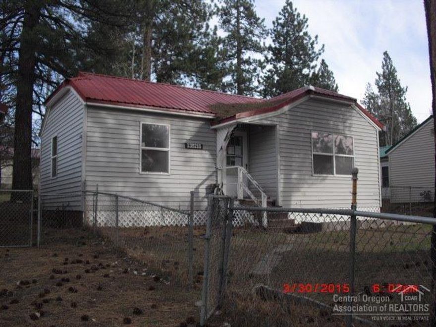 Cozy one bedroom 1 bath Gilchrist Townsite home with tons of potential. Cute kitchen with large windows. Big laundry/utility room that could be used for several things. Fenced yard and tons of storage in the sheds plus a large detached garage. Home is sold as is. Minutes to lakes and mountains to go skiing. See attachments for PAS requirements and WFHM offer submittal information in MLS document section.