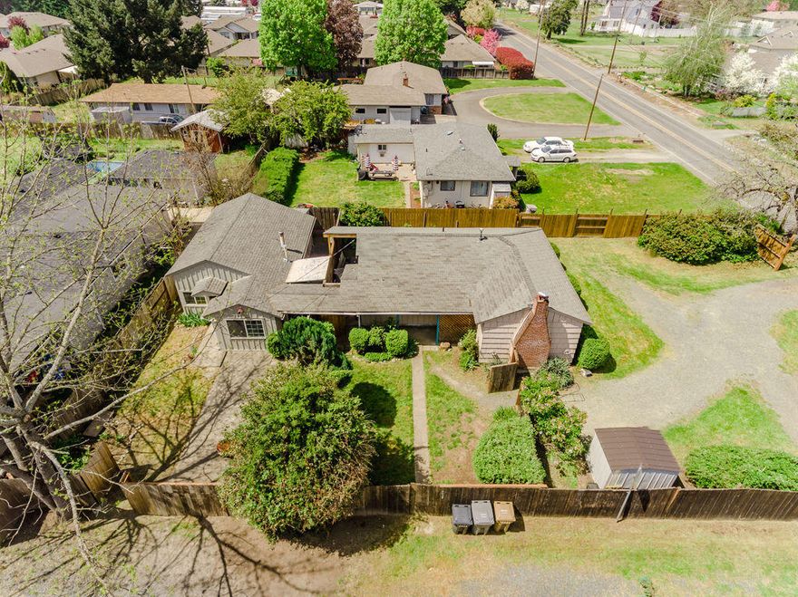 This beautiful 810 sq.ft. cottage has a detached 556 sq.ft. ADU that rents out at $925/month. The main was rented at $1250/month. The living room in the main house features a fireplace and hardwood floors. There is a breakfast nook located just off of the kitchen. The ADU also has a woodstove for heating and an upstairs loft bedroom. A privacy fence with gate separate the ADU and main house, giving privacy to residents of both units. This is a great opportunity to live in one unit and rent the other or rent out both units! The large lot also provides lots of opportunity to make the property truly your own. New electrical panels have been installed on both the main house and ADU. ADU is on separate electrical meter from main house. New hot water heater installed in main house.