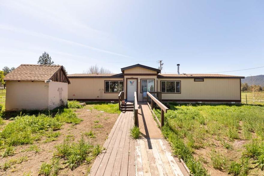 This hard to find 76.74 acre horse property has 69 irrigated acres either flood or sprinkled. (each pod 90 ft coverage diameter. In addition a 4 stall MD horse barn with tack room and possible additional horse stall or hay storage.
Irrigation is with Langel Valley Irrigation District. Please see attached Docs for irrigation Bill, Septic Info, Soil Maps, Well Log, Maps, Listing Aids. Home is a 1984 double-wide 1876 sf manufactured home. Heated with electric forced air furnace, monitor oil heat and Blaze King wood stove. Estate sale. Property sold AS-IS.