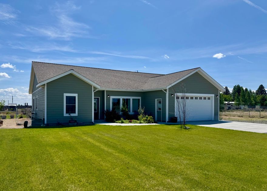 Price improved...Serious seller, serious offers—let's make a deal! This is a three-bedroom, two-bathroom frame home built in 2020 with a view of the golf course. It has recessed lighting, granite countertops, and upgraded cabinets with plenty of storage space. The kitchen features stainless steel appliances. The main bedroom offers a walk-in closet and a walk-in shower. Four mini-split systems keep the home warm in the winter and cool in the summer. The yard is landscaped and has automatic sprinklers. There are covered porches in the front and back. The property is completely fenced. Workshop on additional lot. Includes two separate tax lots, zoned commercial for endless possibilities for building. You will find many recreational opportunities in the area.