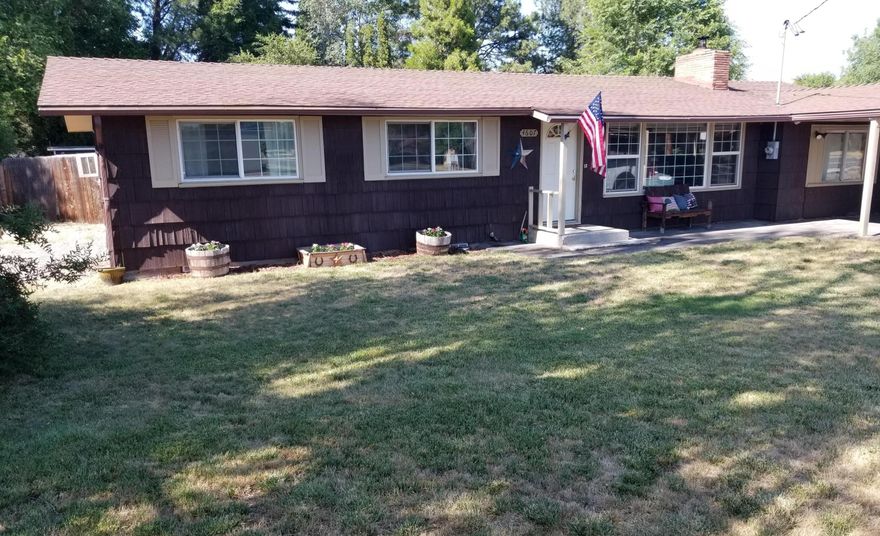 Take a look at this charming ranch style home situated on .34 acres. This 1,800+ square foot home features 3 bedrooms with potential of a 4th bedroom or playroom, 2 full bathrooms, 2 living areas (living room and family room), and a cute kitchen/dining area. Nice hardwood floors, vinyl windows, and an efficient pellet stove that keeps the whole home warm and cozy in the winter are just a few of the inside features that you will love. Outside enjoy a large freshly painted, back deck overlooking your fully fenced backyard plus a nice sized outbuilding/workshop with 110 power. This home may be just the right fit for you! Check it out today!