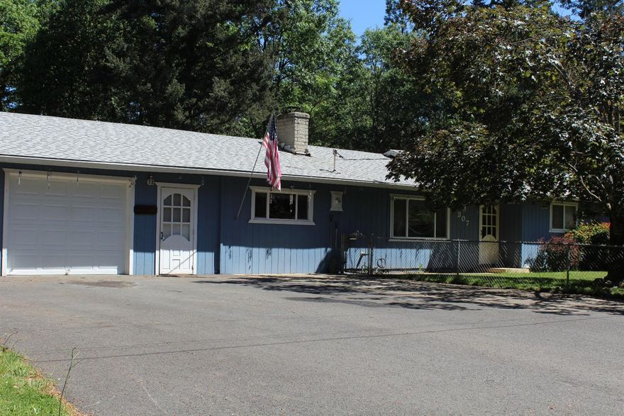 This is a very spacious 4 bedroom 2 bath home, nicely remodeled with newer interior paint, carpet, vinyl, engineered wood flooring, and tiled bathrooms. There is an extra family or game room and a large laundry room from the original garage, converted with care and a nice flow from the house. The one car attached garage can also be expanded by taking down the non-load bearing walls to open it up even further, or leave it alone for the extra room. The entire large city lot is completely fenced with heavy duty cyclone fencing with entrance and exit gates. The roof was done in 2011 and carries a 30 yr warranty with Sears. Exterior paint was done in 2008. Close to schools and in town conveniences. Please see photos for further descriptions.