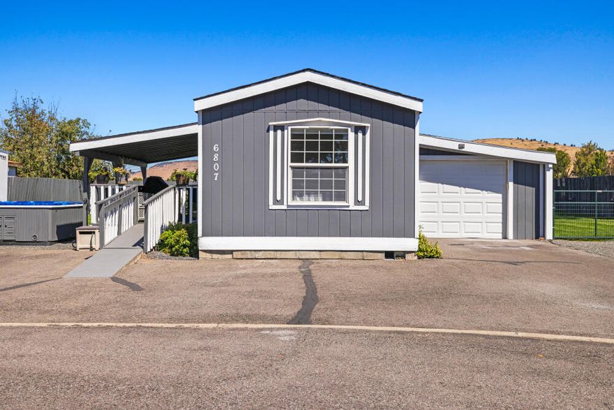 This manufactured home was recently remodeled with many nice upgrades. This is a single wide manufactured home on its own double parcel. The home has 938 sq ft but has an enclosed garage, covered deck and a spa on the landscaped double lot. Owner reports great neighborhood and the property is comfortable and easy to maintain. Newer 30-year roof and the home is a Crown Point by Fleetwood. Many spaces for parking and the association includes two RV parking spaces in the storage area. This home has a 1 year First American Home Warranty which will transfer to the new owner.