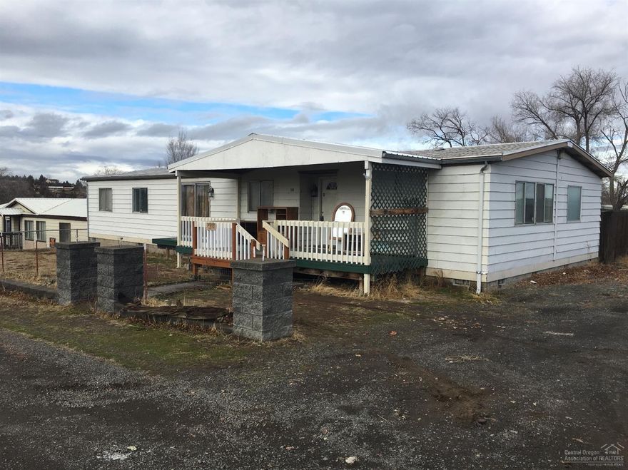 Come see this affordablle 4 bed, 2 bath home in SW Madras. Fenced yard, nice view, country feel, with all the city benefits. Covered front porch, wood stove, block foundation. Easy access to shopping and Hwy 97.