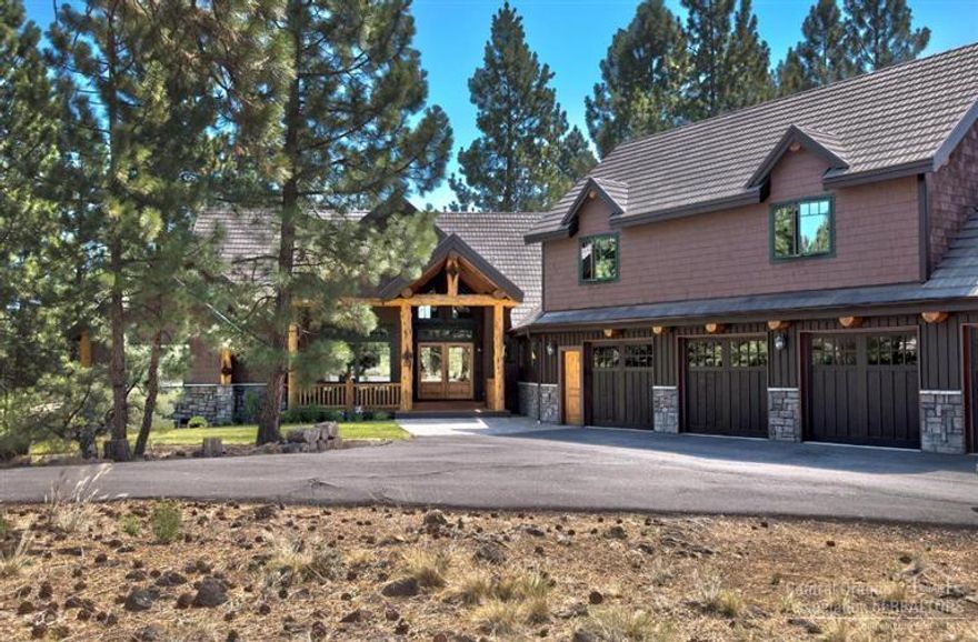 Amazing & Unique horse property INSIDE gated golf course community! Elegant NW lodge home sits on private 2.5 ac in ponderosa pines minutes from town. Unique covenants add ADDITIONAL 2.5 ac irrigated tax-free exclusive use for total of 5ac. Features include: 3 main level bdrms w/ full en-suite bths, large office, custom rock work, large exposed beams, slab granite counter tops, birch wood flrs, oversized knotty alder doors, lg bonus rm w/ wet bar & guest suite, loft, extensive water feature & 4 car garage.