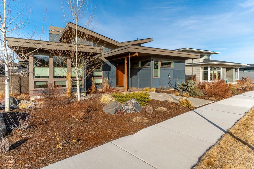 This stunning single level home was constructed by Leader Builders LLC. Ideally situated on a corner lot, moments from Discovery Park, downtown NWX offering shopping and restaurants. The southern exposure of this property allows the home to be warm and welcoming with light-filled spaces throughout. The home features  3 bedrooms, 2 1/2 baths, plus a bonus room/office vaulted ceilings, open concept floor plan and timeless finishes.  There is an oversized 3 car garage with an extended bay & 10 ft tall garage door for all your Central Oregon toys! Enjoy almost zero electricity bills with the solar system that was added to the home in 2021. Upgraded landscaping including patio and added screen plantings to create a private sanctuary in the heart of Bends Westside neighborhood!