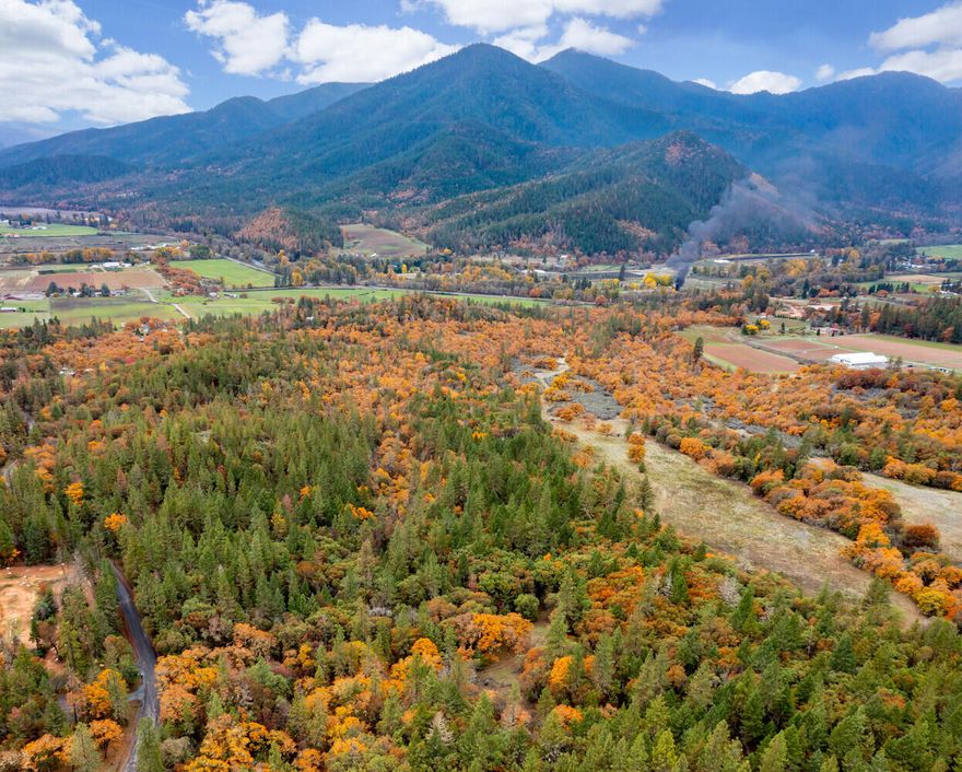 Stunning views from this exclusively private yet not remote property in the heart of the Applegate Valley just minutes from Jacksonville, Applegate Lake & Applegate area wineries. The property consists of two EFU zoned tax lots & has three homesites through a Measure 49 claim. One tax lot is 99.95 acres and the other is 11.27 acres. Preliminary plans have been completed for a partition into three separate parcels each w/ homesite approval. The land is spectacular w/ forested land located near the road to provide privacy that opens up onto several ridges w/ amazing views looking out onto the Siskiyou Mountains. There are several seasonal creeks that run across the property, an abundance of wildlife & the property abuts BLM land on the northwest corner. With a gated entry, a rough roadway winds through the property & power is located at the main road. Perfect location for solar w/ south facing exposure. This is truly a one of kind property. Buyer to do their own due diligence.