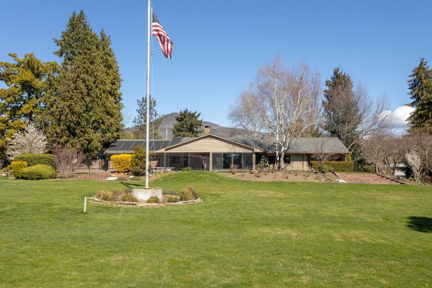 A Golfers Dream Location! Almost 2500 sq ft of main level living. This single level home sits on .68 acres and touches the lush green fairways of the exclusive Private Club, the Rogue Valley Country Club. Entertain or unwind near your in-ground pool or under the shade of the patio area surrounded by luscious mature landscaping. Inside you will find large windows, stone fireplace, remodeled kitchen with stainless appliances, dbl ovens, 5 burner electric glass top stove & granite counters. Breakfast rm w/built in desk, + Formal Dining Room/Den. The large Master suite has large windows showcasing the golf course with doors leading out to the back patio and pool, lg, shower, dbl closets, and built-in drawers. There is an additional 1348 sq ft finished basement with shop area & plumbed for an additional bathroom. Ample storage plus an oversized 2 car garage. This location has it all; close to golf, shopping, restaurants, coffee shop & Asante Medical Hospital.