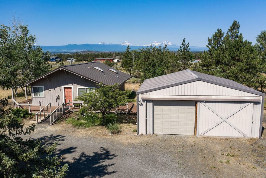 BIG Cascade mountain views that you have to see to believe from this lovely 2.5 acre property in Tumalo!  Located just off Old Bend Redmond Highway on the edge of Whispering Pines subdivision, this adorable cottage boasts brand new vinyl plank flooring, double pane vinyl windows, newer cellular window shades and a metal roof. Open layout feels bigger than 896 sq ft with 2 brs, 1.5 baths and a spacious kitchen. Lots of privacy, lots of light and beautiful views. 644 sq ft garage/shop, 120 sq ft shed and RV parking round out this wonderful property.