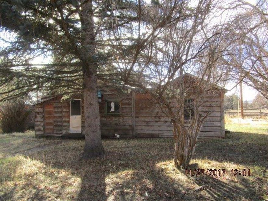 OFFER ACCEPTED . After several rounds of highest and best offers the seller has picked an offer. Subject to final seller approval can not change status until we have an executed contract. An old Homestead! Over 7 acres of level and usable land with an antique cabin and several rustic outbuildings. Get away from the city and have room to spread out. Located on a paved, low traffic road and just a short distance from the town of Bonanza. The well has a newer pressure tank. Limited county on-site septic information available. Sold As-Is.
