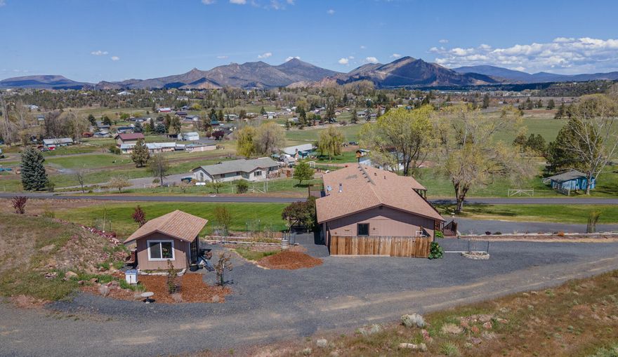 Stunning views in Terrebonne! 1.5 ac two level ranch style in Southwest Terrebonne. Cook in the beautiful chef's kitchen as you gaze at Smith Rock. The wrap around deck is the perfect place to relax all year round. Main floor bedroom with massive walk-in closet and full bath.  Separate lower level entrance makes quick access to the primary bedroom and on suite bathroom. A third bedroom with full bathroom adjoins a bonus room creating a perfect retreat ideal for multi generation living. Spring is here and the gardens are in full swing. Abundant parking for all your toys or build a shop on the ''done for you'' pad.  Quick access to Hwy 97 and the heart of Terrebonne. Don't miss this gem. Schedule your private showing today.
