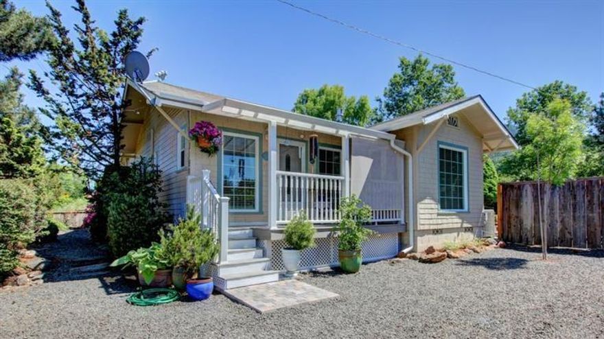 Situated on a huge .44 acre lot with partial TID irrigation available. A gardener's paradise, this charming single level cottage has numerous updates - granite countertops, Pergo floors and built-in hutch in kitchen, double pane windows, HVAC new in 2010. Currently there is an above ground pool in good condition, which can stay or go. Beautiful landscaping and views. You won't want to miss this opportunity!