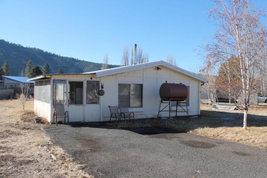 Nice older manufactured home on large lot. Needs work.  There is a water leak under the home that will need to be repaired. Sold as is. Seller can make no repairs.