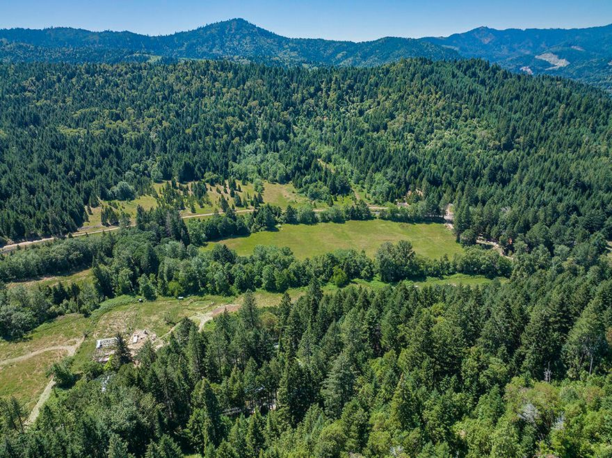 MOTIVATED SELLER! Please bring all offers! This property and home has SO much potential. The home is a fixer and in need of TLC. On the property there is a large shop, huge covered shed and plenty of pasture land for livestock.   Tunnel Creek runs through this beautiful 8.63 acres. The well has a brand new pump, wires, pipes and control box. Home and portions of the property are in process of getting cleaned up. This is a CASH ONLY property and is being sold in as-is condition.  Don't let this opportunity pass you by! Map pack and property line information is attached in documents.