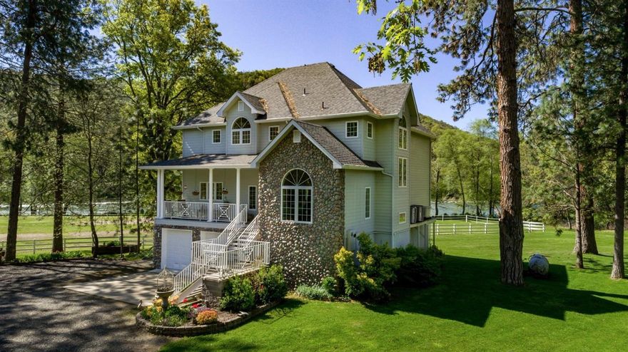 Drive through the massive gated entry and you are in a private secluded world w/1/2 mile of private Rogue River frontage. The 9.83 ac estate zoned WR is bordered by gov't land. The stunning grounds include tri-level 3bd 3 ba home and a huge 6 stall barn with upstairs office. There are two covered equip. sheds, chicken coop and full RV area w hook ups. The 2004 custom home has beautiful 360 degree views and hardwood flrs, granite counters, custom cabinets and stainless app. Lg terraces on upper floors are perfect for entertaining. Property fully fenced and cross fenced with white vinyl fencing. Irrigation from water rights for nearly all fields. Owner is licensed Oregon Realtor. Buyer to do due diligence as to uses and conditions of this property.