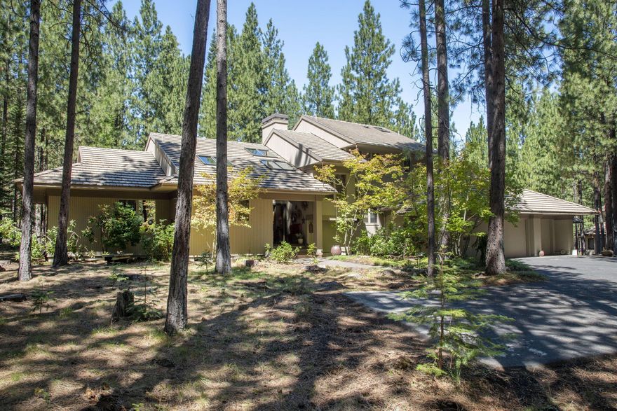 Embrace the dream in this Glaze Meadow home, located in the community of Black Butte Ranch! On 1.71 acres, this home offers a blend of style & privacy for entertaining friends & family. Designed by Steve Van Sant, this spacious 3 bedrm (3 en-suite), 3.5 bathroom home encompasses 3,678 SF & features a 3-car garage, as well as guest quarters which include a bedrm, bath, & art rm, totaling an additional 962 square feet—ideal for artists and carpenters. The Glaze Meadow Rec Center is just a few minutes away. Upon entering, you will be greeted by a large Great Room, which boasts a stunning floor-to-ceiling stone fireplace, a gourmet kitchen, a dining area which accommodates up to 12 pp, along w/ a spacious family rm. The extensive deck provides beautiful views of a lightly wooded area. There is also an office w/ built-in cabinets, a laundry rm, updated 1/2 bath, & primary bedrm suite w/ his & her closets. Upstairs you will find 2 en-suite bedrms. This home is heaven!