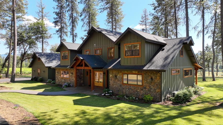 Magnificent 4 bedroom 3.5 bath custom built home with salt water pool and a charming park setting in the heart of the Applegate Valley. This dream of a kitchen features stainless appliances, 6 burner gas stove, spacious pantry, granite counters, kitchen island, large copper farm sink, pot fill and soft close drawers. Master bedroom located downstairs with step in shower, soaking tub, double vanity sinks, massive walk in closet and a view. The open floor plan allows a view of the grand fireplace and picturesque windows overlooking the fully landscaped backyard and neighboring vineyard. Upstairs features a 2nd laundry room, full bath and 3 additional bedrooms. 5 garage spaces! 3 car attached with full bath and storage/shop space and a detached 2 car garage with carport and room for your RV. Hardwood floors and stunning knotty alder finishes throughout this must see home. Too much to list and this home comes nearly furnished. All information deemed reliable but not guaranteed.