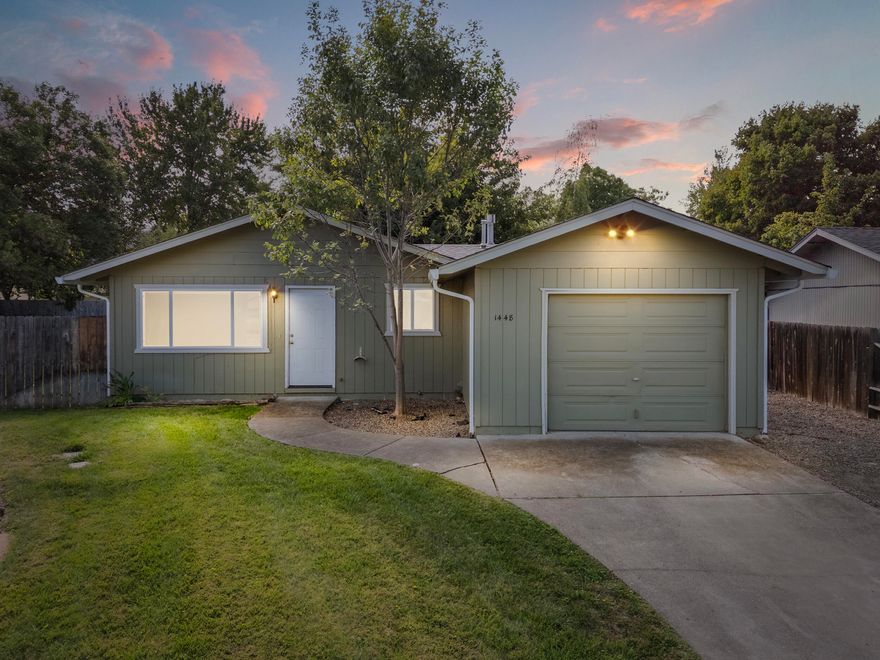 Discover comfort and convenience in this beautifully maintained home tucked away on a quiet cul-de-sac in East Medford.  The light-filled living room flows seamlessly into the dining area and kitchen, creating an inviting space perfect for everyday living and entertaining.  Enjoy modern updates including stylish flooring, neutral finishes, and a thoughtfully designed kitchen with ample cabinetry.  Step outside to a fully fenced large backyard-ideal for relaxing, gardening, or gatherings with family and friends.  Additional highlights include an attached garage, central heating and air, and convenient proximity to parks, shopping, and schools.  A perfect blend of comfort, location, and value-this charming Medford home is move-in ready and waiting for you.