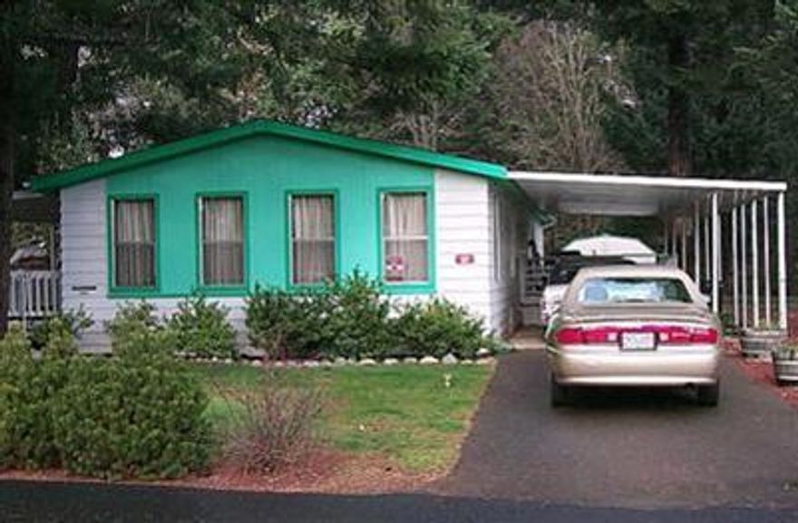 FOR INFO PURPOSES ONLY - MFG HOME ONLY FOR SALE. NO LAND INCLUDED. A BCD license is required to list or sell this mobile home. Established 55+ M/H park. This well maintained double wide features 2 bedrooms and 2 baths, family room, walk in pantry, two large decks, 2 outbuildings, fencing and more. There is a sliding glass door off to the front deck. The front deck is covered and almost the entire length of the mobile where you can sit in the summer or winter and relax. The rear yard is fenced for your pet. If your looking to move into a park, this one is it! Come and see for yourself...