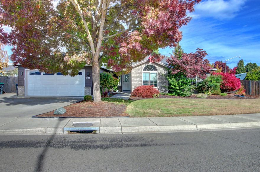 Great Central Point home on a large .24 acre corner lot that affords TWO RV parking areas, one with power!  Back yard has it all!  Covered patio/bar area, horseshoe pit, incredible waterfall feature, grape arbor, patio off of master wired for a hot tub, paver patio with fire pit, large shed, motion lighting and more.  Hardwood and tile flooring throughout, granite kitchen with stainless appliances, Silgranit sink, and breakfast bar.  Gas fireplace and large picture window in the vaulted living room, built-in speaker system, and utility room with sink.  Master has French doors to the patio, double sinks, tiled shower, skylight, and walk-in closet.  In a desirable neighborhood minutes to downtown