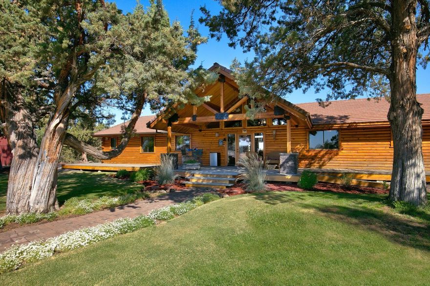 Country Home with Mt Jefferson Views and a private setting.  24.8 acres with 9.5 acres of COID water rights. Well maintained ranch style home is light and bright, 2468 sq. ft. with an open floor plan, single level, great kitchen, pantry, dining area with views of the mountains, living room with fireplace, 2 bedrooms, large master suite, office/bedroom and attached two car garage.

Wonderful outdoor living that is very private with patio and deck overlooking landscaped yard, hot tub, horseshoe pit, fire pit, mature landscape and trees. 8 stall barn with tack room with runs. Shop/Barn with room for RV, Greenhouse
Pond with 5 HP Pump for Irrigation. Grass pastures with shelters for turnouts. Property has lots of room for any kind of livestock, great arena, trail course for your horses or Llamas. Terrific location approximately 5 minutes from Redmond and 20 minutes to Bend in the heart of Central Oregon!