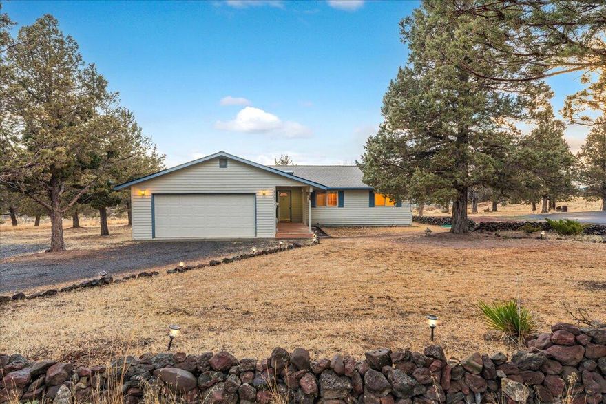 Set against the stunning backdrop of the Cascade Mountain Range, this 1,504-square-foot home in Terrebonne, OR, offers a perfect blend of comfort and natural beauty. Featuring 3 spacious bedrooms and 2 bathrooms, this home boasts beautiful wood floors throughout and luxurious granite countertops in the kitchen and bathrooms. The inviting living space is enhanced by a propane fire stove, providing warmth and ambiance. Outside, you'll find a 1300sq ft, 3-bay shop with 14ft roll up bay, ideal for storage, hobbies, or a workshop. With panoramic mountain views and a peaceful setting, this home is the perfect retreat for those seeking both style and functionality.