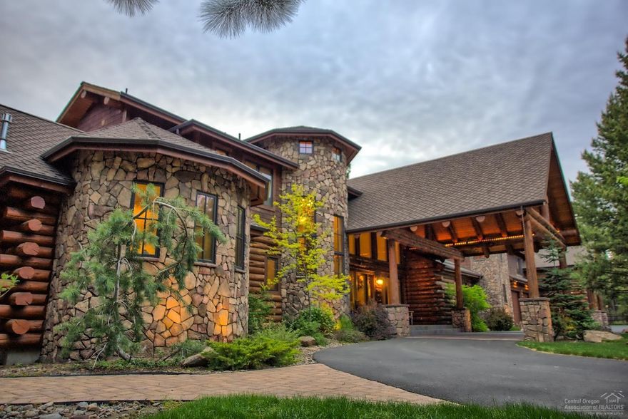 Custom Built Log home designed with quality finishes throughout & for entertaining. The gated entry welcomes you to this beautiful riverfront home on the Big Deschutes with its own private dock. As you enter the home you will be greeted w/the wall of windows & views of the river. Vaulted living area w/log accents & wood burning fireplace w/solid slab granite hearth. Designer kitchen features a huge solid slab granite island, Thermador Professional appliances, double ovens, knotty alder cabinets, & sub-zero refrigerator, 2 pantry's & a wine room. 3 master bedrooms, one has heated floors & custom stone artwork in the walk-in shower & soaking tub area. Office, art studio, guest room, & Billiard room that leads to the It's 5 O'clock somewhere'' Party room w/a solid slab granite bar that fits 8 stools w/a 2nd kitchen area. Upper level deck & paver patio & Trex deck. The heated RV garage is 55' deep, w/full RV hook up. There are 2 additional RV hook ups. 20' Pontoon boat included.