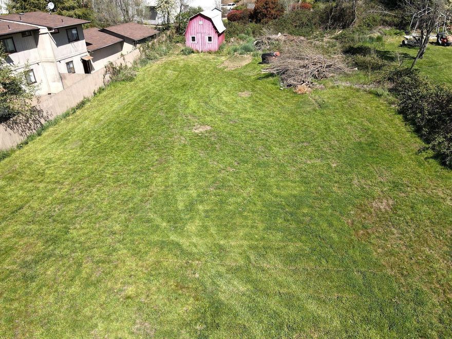 Rare development opportunity in NE Grants Pass! 2060 NE Fairview is a flat, 0.35 acre parcel zoned R-3. Located in both an Opportunity Zone and Enterprise Zone, this lot could offer an opportunity for tax incentives for eligible development. Utilities are fully available at the street, property has a driveway cut, and has road frontage. Situated near shopping, restaurants, services, and with quick access to i5. With strong demand for housing, this lot offers great flexibility for several multi-unit housing options with moderate to high density zoning. Don't miss out!