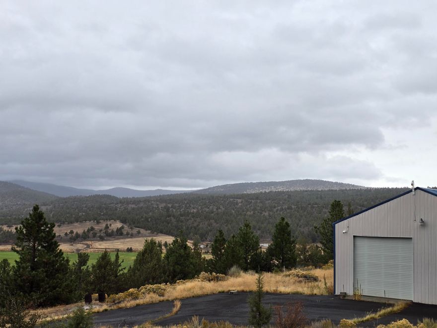 Nestled on 63.5 acres above Dog Lake, The Retreat at Meadowline Ridge offers privacy, views, and multiple living options in one of Lake County's most scenic corridors.

The main shop building has a simi-finished with 1 bedroom and 1 bath living quarters, perfect for immediate use or as a base while developing further. A cabin with a deck sits higher on the property, providing a guest space or a quiet getaway spot with sweeping valley views. An additional homesite with septic already installed is ready for a new build, offering flexibility for a permanent residence.
Key Features

63.51 acres with meadow, timber, and ridge views

Shop with 1 bed / 1 bath living quarters

Cabin with deck overlooking the valley

Additional homesite with septic installed

2,080 sq. ft. general-purpose building

Geodesic dome greenhouse structure

Well, septic, and power on site

Minutes from Dog Lake and Drew's Reservoir