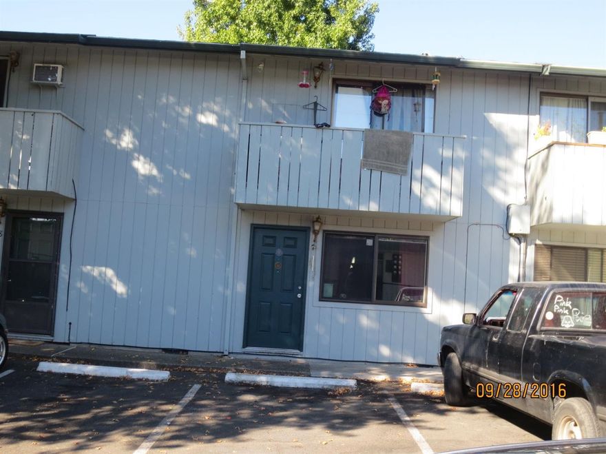 Easy Living - Affordable Condo! 2 bedroom, 1.5 bath, 876sf condo conveniently located near schools and shopping. Great first time homebuyer or investor opportunity. Used as rental so little rough. 1/2 bath is on main level, small fenced patio, upstairs full bath has tiled tub/shower surround. Washer dryer hook up in kitchen for stacked units.