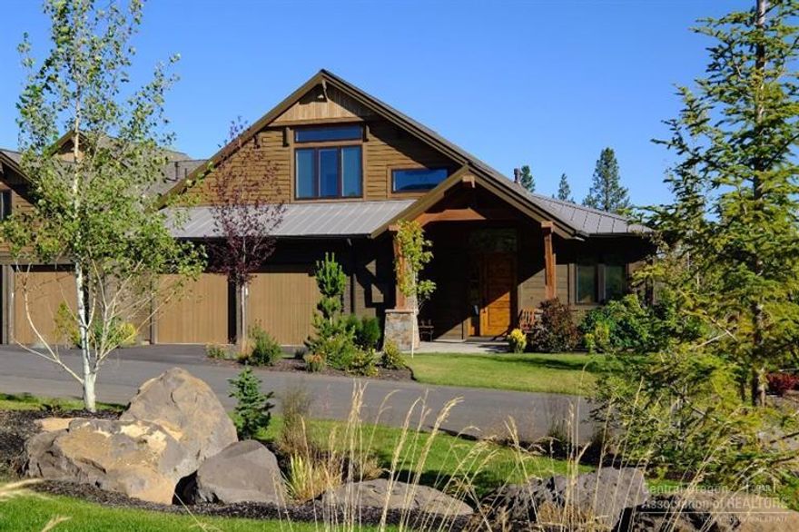 This beautiful Mountainside Tripleknot townhome welcomes you with a spectacular setting, unobstructed golf course & stunning mountain views. This gorgeous home features an incredible Great Room & Gourmet Kitchen w/ Master Suite & Office on the Main Floor. Two Junior Suites upstairs. One of the best & largest lots in the neighborhood. A custom rock wall surrounds the patio that overlooks the 10th fairway of the Tetherow Golf Course. Numerous upgrades & custom features set this home apart.