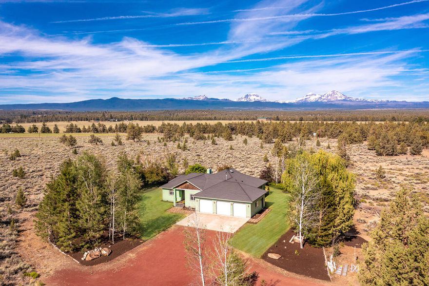 Custom built single story home on almost 30 acres of private oasis with Cascade Mountain views. Convenient location between Bend & Sisters! No CC&Rs & No HOA. Nearby public lands & trails. Highlights: covered front porch, hardwood & slate tile flooring. Large kitchen with hardwood cabinetry, granite tile counters, & a pantry. The spacious family room has a vaulted ceiling and amazing views, plus a wood stove. Master Suite offers a cozy propane fireplace, a huge walk-in closet with built-in organizers, plus a private bath with dual sinks, jetted tub, & walk-in shower. 3rd bedroom has been used as an office w built-ins, a big closet, & lovely hardwood flooring. The utility room has a sink & plenty of storage. The 2400 sq ft barn is ready for hay, equipment, animals, or your future workshop. It has 2/3 concrete flooring, frost-free water, electricity, & 2 RV doors for easy drive-through. Qualified Buyers only please. Sellers are motivated due to family injury. Bring an offer!