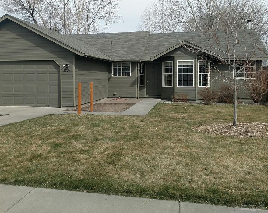 Home features kitchen with tile floors, marble tile countertops and bright sunny dining area. Solid oak flooring in entry and living room. Efficient Mitsubishi heat/cooling system and woodstove. Fully fenced private backyard and large deck. RV or boat parking.