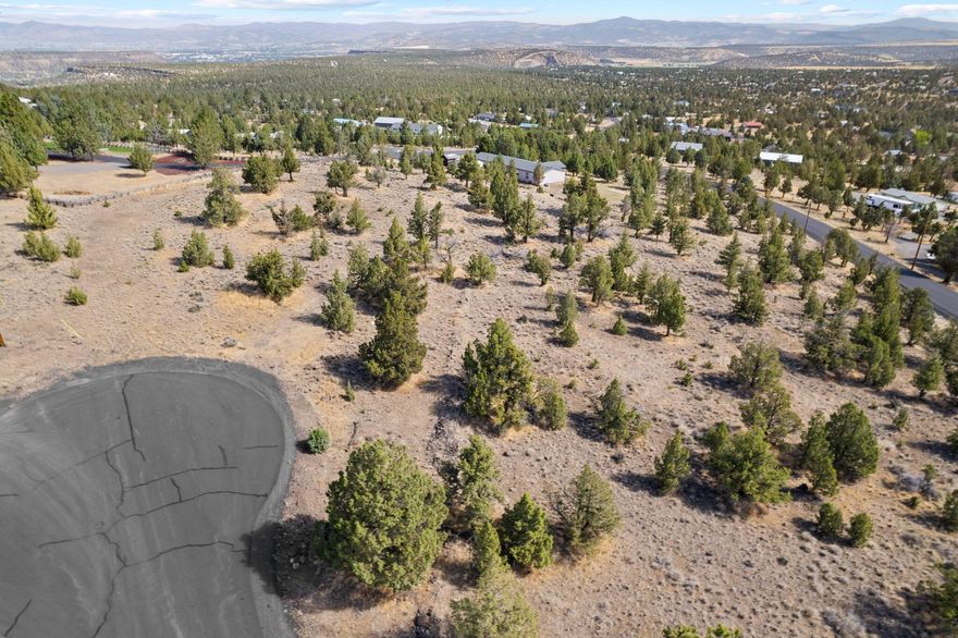 Perched on a hill in the highly desirable Highlands neighborhood, this 3.7 acre parcel already has a septic system in place and is ready to build your dream home! Surrounded by trees and views, you'll feel the ultimate sense of privacy while only being a short drive into Prineville to grab dinner or to the Reservoir to enjoy endless outdoor recreation. Community water is provided - no need to dig or maintain a private well. Come see this beautiful property and start living your Central Oregon dream life today!