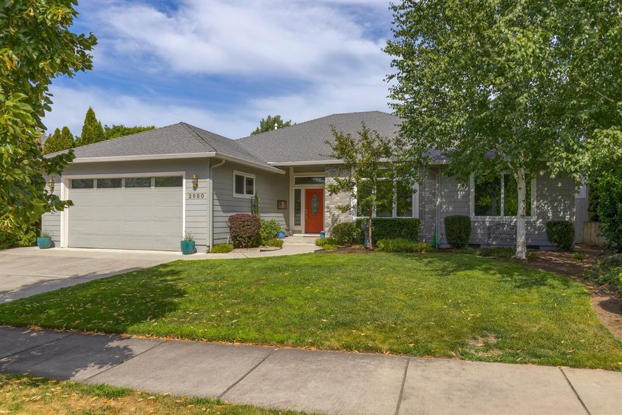 This Home is Absolutely Gorgeous! The Seller spared no expense on the recent remodel of the Kitchen and Backyard! Beautifully designed Kitchen features custom painted cabinetry, stunning chiseled edge granite counters, new high-end appliances that include a Bertazzoni 5 burner gas range and hood, farmhouse sink and custom tile backsplash! New Flooring throughout! Open Great Room concept with lots of built-ins, a gas fireplace and with high ceilings, skylights and pictures windows makes this home naturally light and bright! Nice size Master bedroom, lg walk-in closet, dual sinks in the master bath, tub and separate shower. The backyard features a large covered patio, brand new extended paver patio with a water feature, new retaining wall, fencing, shrubs and grass. Unobstructed views of Roxy Ann Mountain. Large utility room off of the kitchen with a sink and bath with access to the oversized 2 car-garage. Highly Sought after established neighborhood with Great Schools!