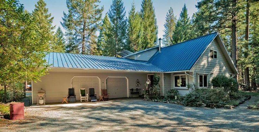 Rare find, legal two possibly three family setup. Two homes and an apartment, perfect for multiple families or live in one and rent out the other two. These homes are set in a little piece of paradise. Nestled in the woods and off the main road you feel like you are miles from civilization. Huge RV barn, beautiful pond, fenced vegetable garden and much, much more. One home is 2199 sq. ft. 3/2 and two car garage plus shop and an apartment approx. 600 sq.ft. 2nd home 1232 sq.ft. with 3/2 and two car garage. Both homes are on separate septic's and on a shared well. Recent well flow tested at a steady 9.7 GPM. Sale fell due to no fault of property or home.