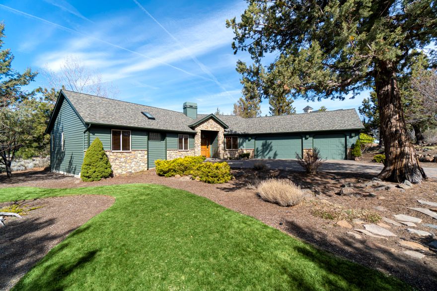 Spacious single level home atop desirable Awbrey Butte neighborhood. Beautifully situated on large .50-acre lot with mature landscaping and large paver driveway to 3-car garage. Inviting floor plan features spacious sunken living room, large kitchen, formal dining, breakfast nook and open family room. Vaulted master suite with spacious sitting room, walk-in closet and large en suite with dual sink vanity, soaking tub and tile shower. Open kitchen features prep island with built-in wine cooler, abundant cabinetry, and stainless steel appliances. Beautiful maple wood floors in kitchen and formal dining room. Covered rear deck overlooks private back yard. Impeccably maintained home inside and out!