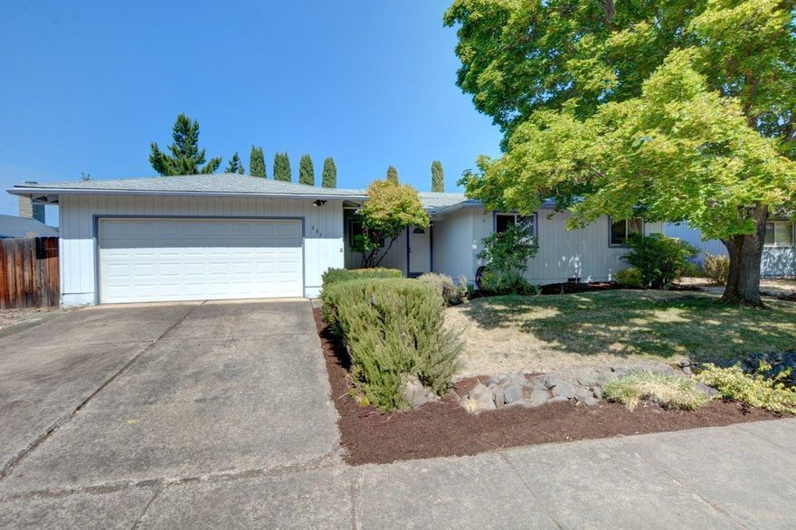 Welcome to this lovely 3 bedroom, 2 bath home, offering 1,602 square feet of comfortable living space on a spacious .23-acre lot. Brand new roof with 50 year transferrable warranty! The updated kitchen has tile floors with the look of wood and rough-edged, decorative stained concrete countertops. The kitchen opens into the drop-down living room through a standing bar. There is a separate family room with a cozy fireplace and a slider to the backyard that provides flexible space. Enjoy the large backyard that is fully fenced, with an expansive partially covered deck, and a gazebo, wired for a hot tub. The finished, insulated 2-car garage with wall A/C is perfect for a workshop, hobby room, or parking. Located near Twin Creeks, restaurants, shops, parks, medical, and pickleball courts. 1 year First American Home Warranty with HVAC coverage. included!  Schedule a tour today!