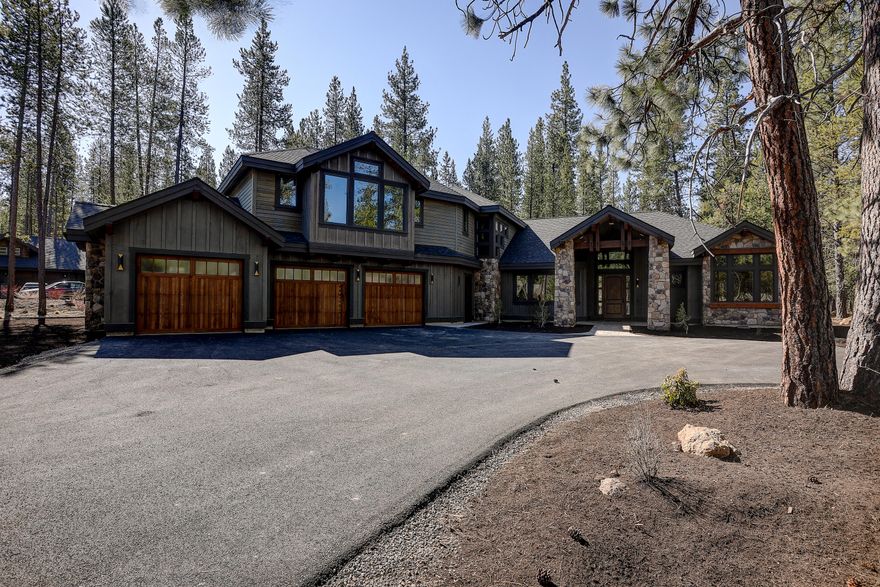 Newly Built Luxurious Craftsman residence in highly sought-after Caldera Springs Resort.  Beautifully appointed this quality crafted home offers 6 Bedrooms/ 6.5 bath located on .60 of an acre. 4213 square feet of luxurious living space with extensive stone and rock both inside and out. High end finishes throughout the home features, a master suite with gas fire place, 4 guest master suites featuring their own private bath, 6th bedroom/bunkroom with flex room, a grand towering timber framed entry way opening to high vaulted 18' great room with a cedar encased ceiling, great room has a majestic stone gas burning fireplace, hardwoods, a cooks dream gourmet kitchen with a spacious dining area, large central working island, perfect for entertaining family and guest. stunning rustic staircase made from large old-world timbers, office, 3 car garage hosts wiring for electric cars. Step outside to enjoy an expansive year around covered patio and cozy up to the gas fire pit for relaxing.