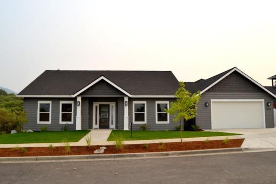 Rare opportunity to own a ultra custom home at builder cost. Now nearing completion and exquisitely crafted to the standards of a buyer who is not moving in. This amazing craftsman style custom home has 9ft and coffered ceilings with crown molding, and quartz countertops throughout. Sumptuous and warm hardwood and tile flooring and extensive attention to detail not found in your average home. The Living room upstairs with fireplace and views of the surrounding mountains. Daylight basement level features another bedroom,full bath, family room area as well as craft room and a covered patio. The property is all fenced and landscaped and a rare find in Meadow wood subdivision in Grants Pass in the final phase. This honey is just completed and move in ready. Best of all for you this is priced below the builder's cost. Come take a look. and enjoy the wonderful views from this amazing home.