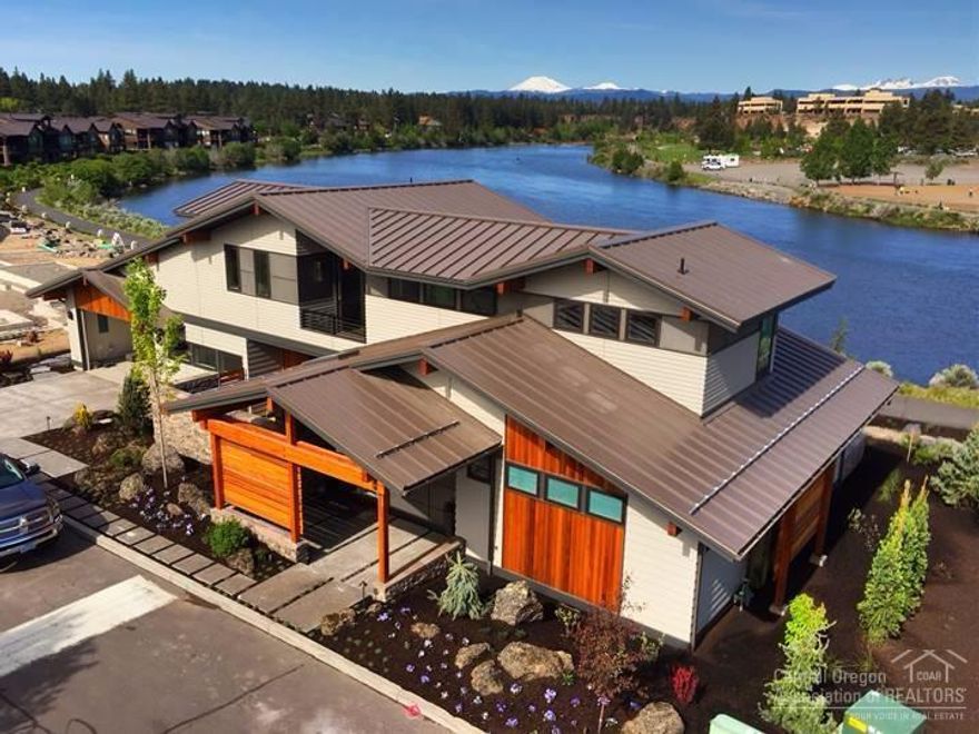 This amazing Turn Key Vacation Rental makes it easy to start enjoying you Central Oregon Dream Home! Enjoy the clean lined contemporary interiors: Quarter Sawn White Oak flooring, stunning tile & stone accents with unique design elements. The well-appointed kitchen boasts high-end Decor appliances, stunning backsplash & solid quartz countertops- all with lovely views of the river. The outdoor living area with built in BBQ & gas fireplace is perfect for outdoor entertaining.