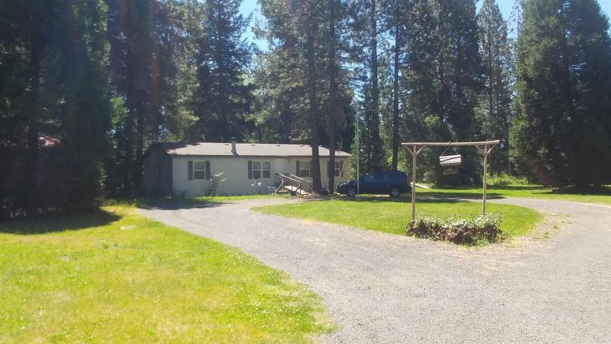 A little work and this home will shine again! This peaceful setting will help you to relax and reconnect after a long day of work. Property is fairly flat and once had a pasture for cows. Just enough room to create your own personal happy place. Come check it out today!