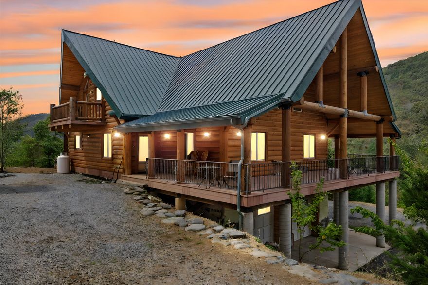 Discover a rare opportunity to own a remarkable mountain estate where timeless design meets modern sophistication. Completed in 2014, this custom log home features vaulted ceilings, rich wood finishes, and expansive windows framing breathtaking panoramic views.
A private paved drive leads to the striking main residence with a spacious four-car garage and shop. The property also includes a second two-story residence with a root cellar and garden boxes. Ideal for guest quarters, a rental, or a creative retreat.
A classic barn with an upstairs loft offers flexible space for entertaining, storage, or artistic pursuits. Set on an expansive parcel and surrounded by natural beauty, the estate balances seclusion with sophistication.
Whether envisioned as a private sanctuary, legacy property, or elegant retreat, this one-of-a-kind estate invites you to live beautifully in the mountains.