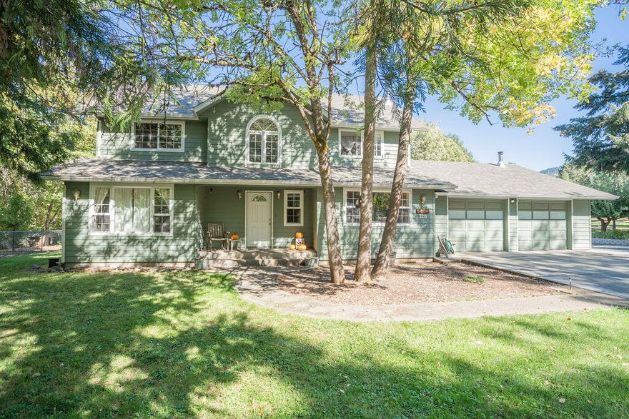 This beautiful custom home has it all! Located less than 10 minutes from town in a beautiful parklike setting. The main level has a light & airy open floor plan with a den, office, dining room, beautiful living room and kitchen with new countertop & stools for plenty of company. New LVF on most of the main level. The lovely staircase leads up to 2 spacious bedrooms & a full bathroom. Master suite has a large full bath, walk-in closet & a cozy little sun room. Leading up from the master suite, is the 10 x 40 insulated bonus room. Through the dining room doors is an inviting covered patio w/a large back yard which has a deer-proof fence to protect your garden. Other features include large utility/mudroom, & another full bathroom off the oversized insulated 2-car garage. RV parking w/dual dump connections & full hookups. The property is bordered by seasonal Fruitdale Creek. The home has been lovingly maintained over the years & is a perfect family home that won't last long!