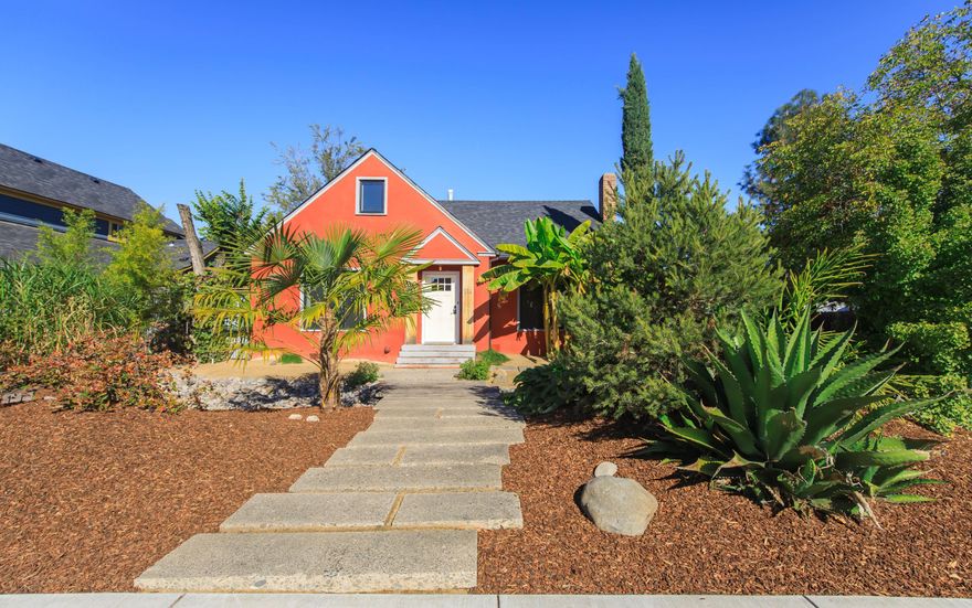 Well cared for home brimming with vintage charm!  There have been many thoughtful updates over the years done with care to not take away from the original character. All living space is conveniently located on the 1188 Sq. ft. main level, featuring original hardwood floors in the living area and bedrooms. The spacious living room includes a cozy wood-burning fireplace, and the adjoining   dining room offers classic built-ins.  The kitchen provides ample cabinet space and  includes stainless appliances.
A convenient  laundry room  provides easy access to the back yard. The  570 sq. ft.  attic has both interior and exterior access, and separate electric and gas meters----currently used for storage but offering many potential uses (buyer to do due diligence).
The yard is nicely fenced and landscaped with a drip system, and the property includes a detached single car garage and has alley access.