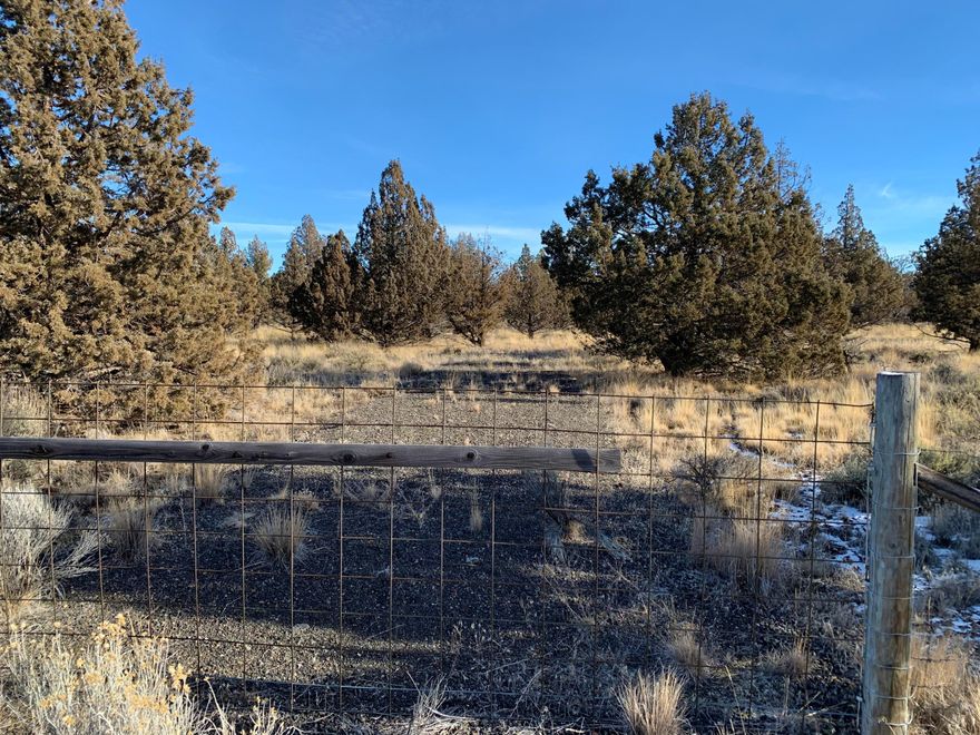 This is the property you have been waiting for! This completely fenced 1.89 acre parcel of buildable land on a paved road is waiting for you! Septic feasibility has already been completed by the county. Standard septic approved. The land is a blank slate for you to build your dream home! Association fee of $125 a year is for road maintenance. Community water available to haul for additional fee.