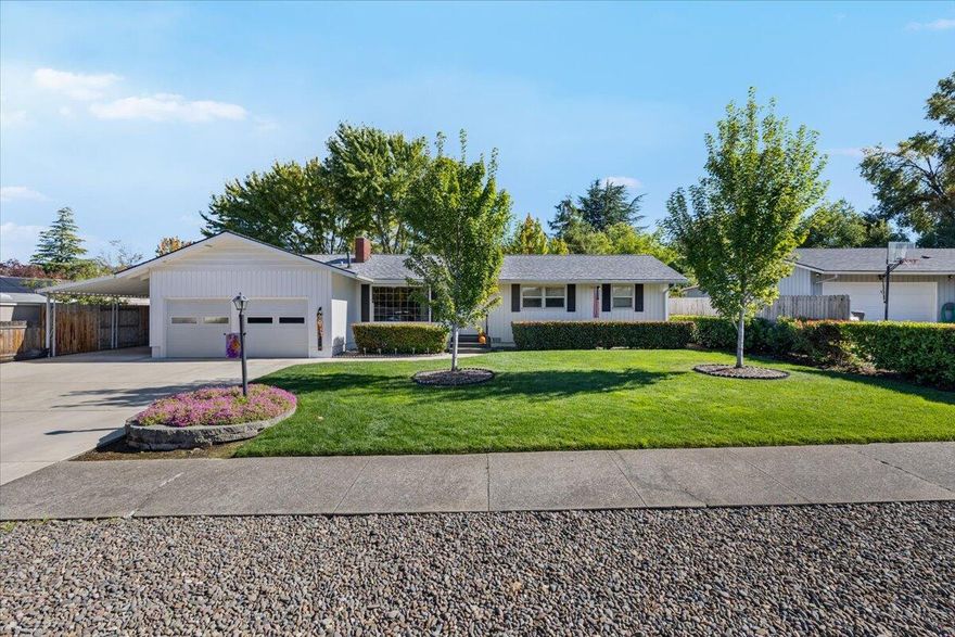 Amazing location and absolutely fabulous in every way. This immaculate 3-bedroom, 2-bath home is a true showpiece inside and out. Beautifully landscaped front yard, two-car garage, and huge RV parking with extended concrete pad that can fit even a large bus. Exterior paint is stunning, roof is newer, and the windows are upgraded vinyl double-pane. Inside features real hardwood entry, perfect carpet, and pristine interior paint. The kitchen offers painted cabinets, bay window overlooking a peaceful backyard, and plenty of storage. Separate living and family rooms, tile flooring in bathrooms, and a full tile walk-in shower. Large covered patio ideal for outdoor entertaining, fenced backyard with mature landscaping, and a storage shed. Laundry room with tile floors and extra cabinetry. Garage includes workbench area and overhead storage. Forced heating and air throughout. A truly gorgeous home in move-in condition.