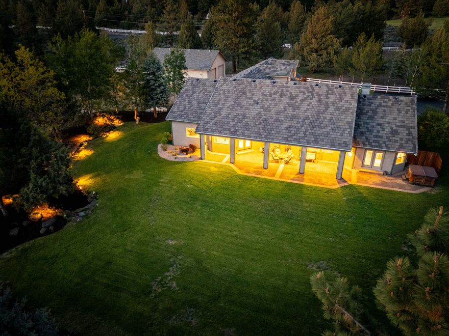 RARE FIND! The Sanctuary Estate - 20 pristine acres where luxury meets nature! This stunning single-level retreat features three oversized bedrooms plus a wonderfully large office, soaring cathedral ceilings throughout home, Great Room design features a Chef's kitchen w/Dacor 6-burner range, butcher block island with prep sink, breakfast booth, fireplace, family room, spa-like master suite w/fireplace, doorless marble and glass walk-in shower, elevated soaking tub, vanity station + French doors to outdoor hot tub, and custom Canadian red birch cabinetry throughout. BONUS: Nearly 1000 sq ft Bonus Room above 4-car garage + massive 36x41 shop/barn w/fenced pasture! Covered patio w/electronic blinds, waterfall/pond sanctuary, paved driveway with pillar entry. Fire-defensible landscaping, cement tile roof. Minutes from Bend yet completely private - mallard ducks return annually! . Multi-generational living friendly.  PRICED TO SELL - won't last!  Call today for a private tour.