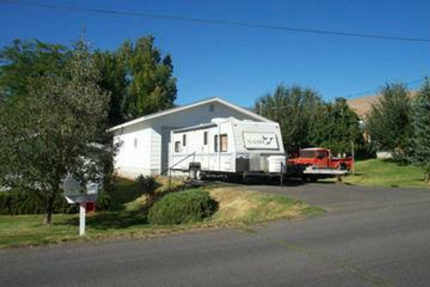 Great Suburban Lot With 26 X 40' Shop, 220 V Single Phase And + 212 X 10' Doors. Fruit Trees. Can Also Purchase With Lot 2 With Home For 170,000.