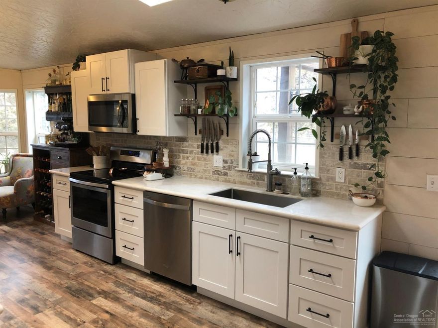 This five acre horse property is nestled in a quiet country setting with backyard access to BLM. 1506 sq ft home renovated in 2017 has three bedrooms plus a den/office. Soft close cabinets, stainless appliances and marble counters make a modern and enjoyable kitchen. Large master bath has double vanity, tile shower and clawfoot tub. Intergrated Smart TV and Smart thermostat. New roof, floors and paint in 2017. Backyard includes large pergola, surround sound outdoor audio and heavy steel firepit. Two large fenced dry lots. Power and water at storage shed and chicken coop. A wonderful place for you and your animals to call home.